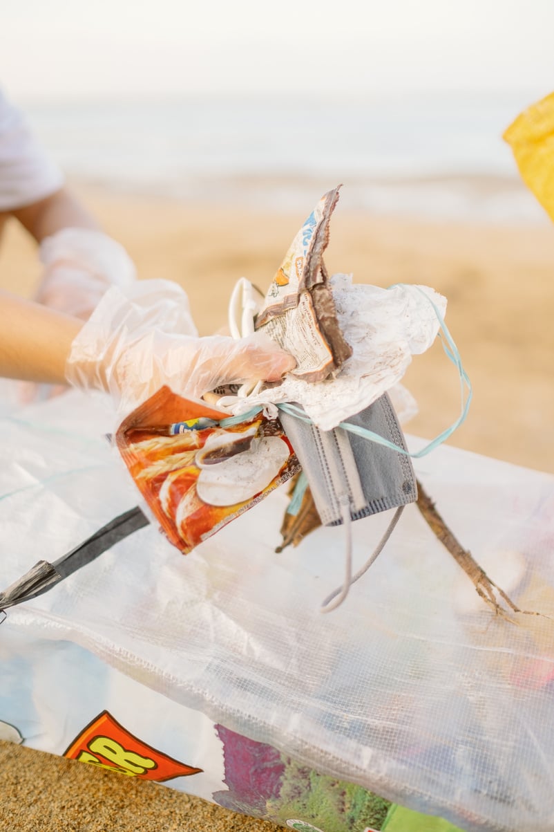 Hand Holding Trash 